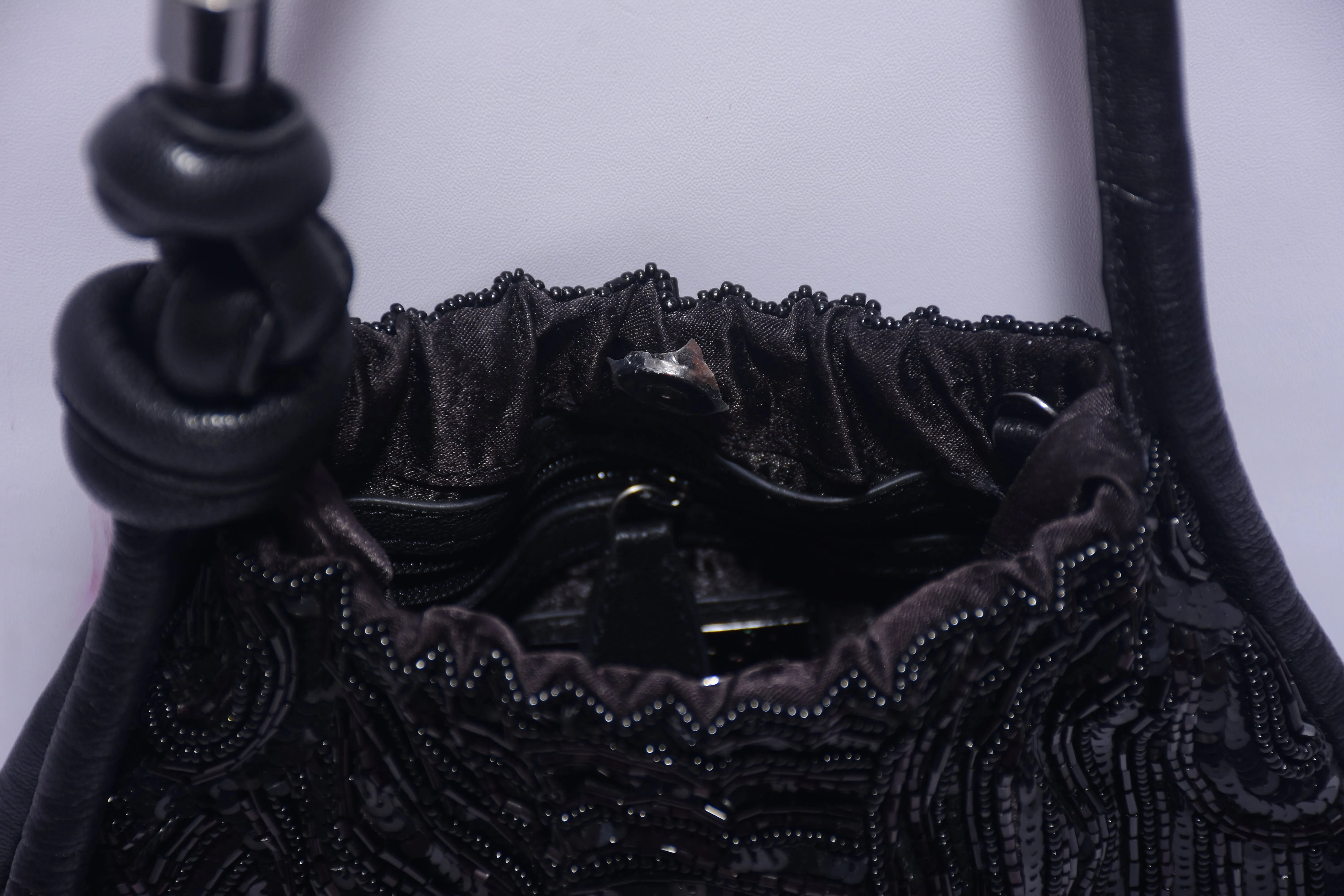 KNOTTED SEQUINNED PURSE