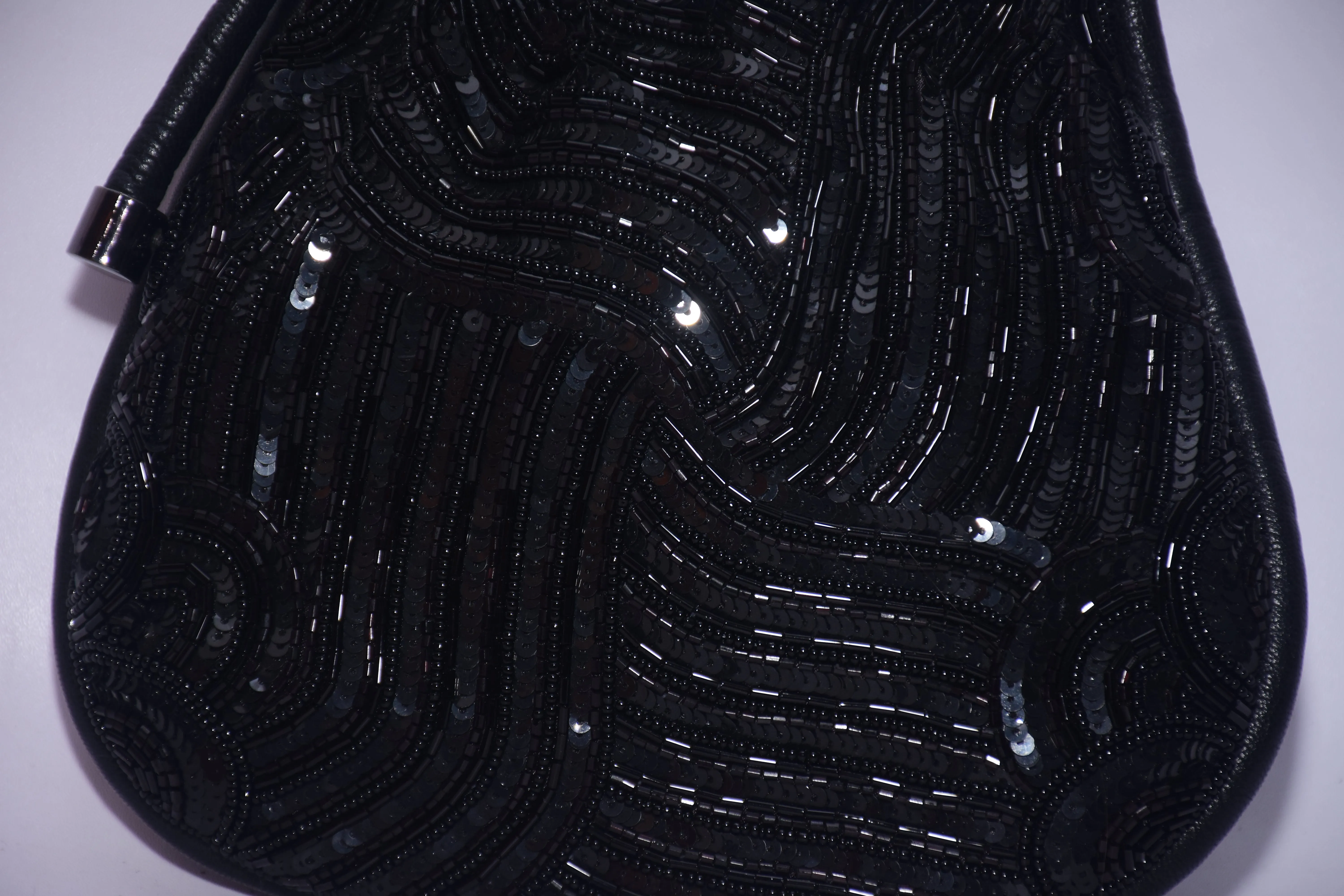 KNOTTED SEQUINNED PURSE
